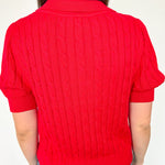 Collared red v neck short sleeve sweater. Knitted look. Regular fit.