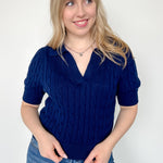 Collared navy v neck short sleeve sweater. Knitted look. Regular fit.