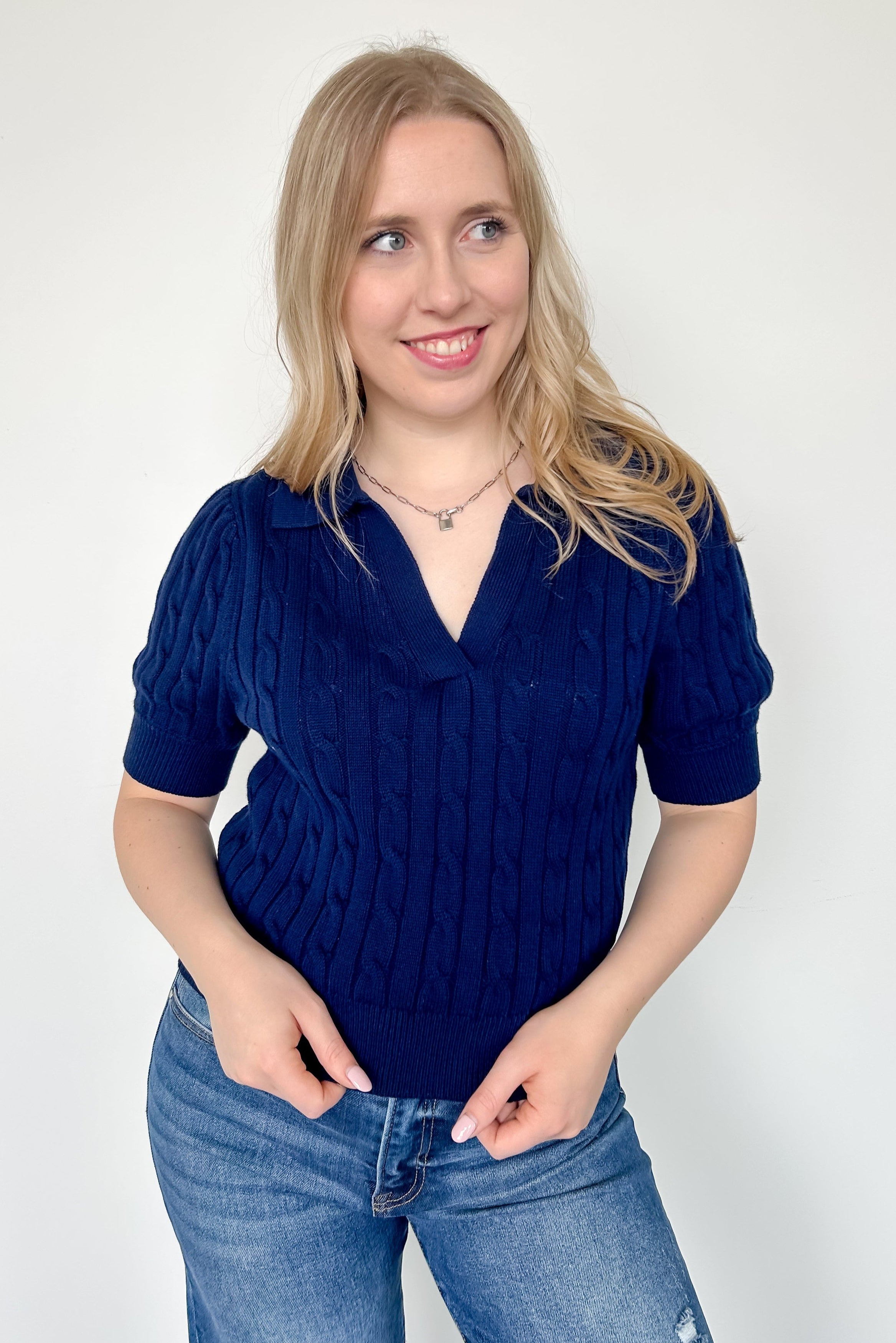 Collared navy v neck short sleeve sweater. Knitted look. Regular fit.