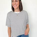 White and black striped tee with ringer neckline. Short sleeve. Oversized fit.