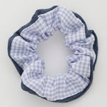 Photo of a blue, plaid print hair scrunchie 
