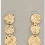 Photo of a gold, hammered metal, triple coin dangle earring 