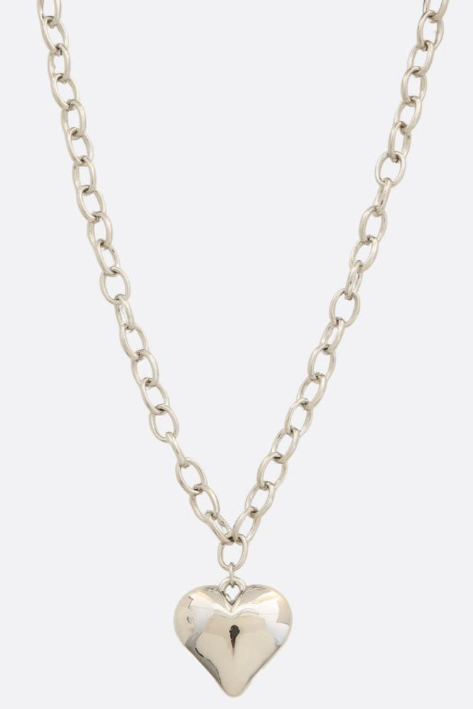 Photo of a metal chain necklace with heart shaped pendant 