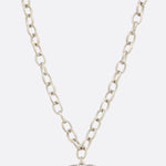 Photo of a metal chain necklace with heart shaped pendant 