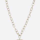 Photo of a metal chain necklace with heart shaped pendant 