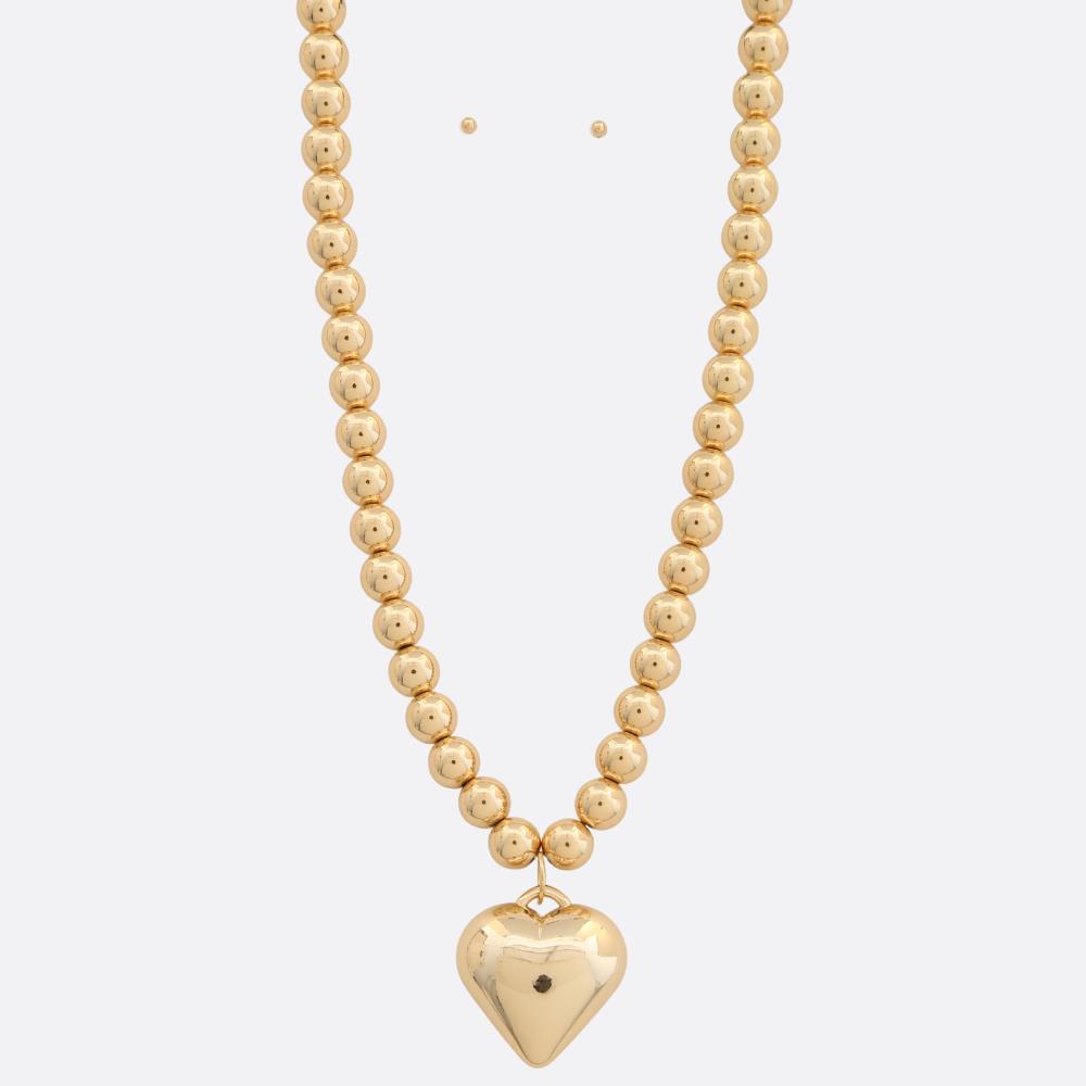 Photo of a beaded metal necklace with a heart charm 