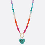 Photo of a colorful beaded necklace with a heart-shaped stone pendant 