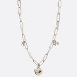 Photo of a silver, oval link, charm necklace 