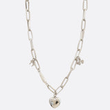 Photo of a silver, oval link, charm necklace 