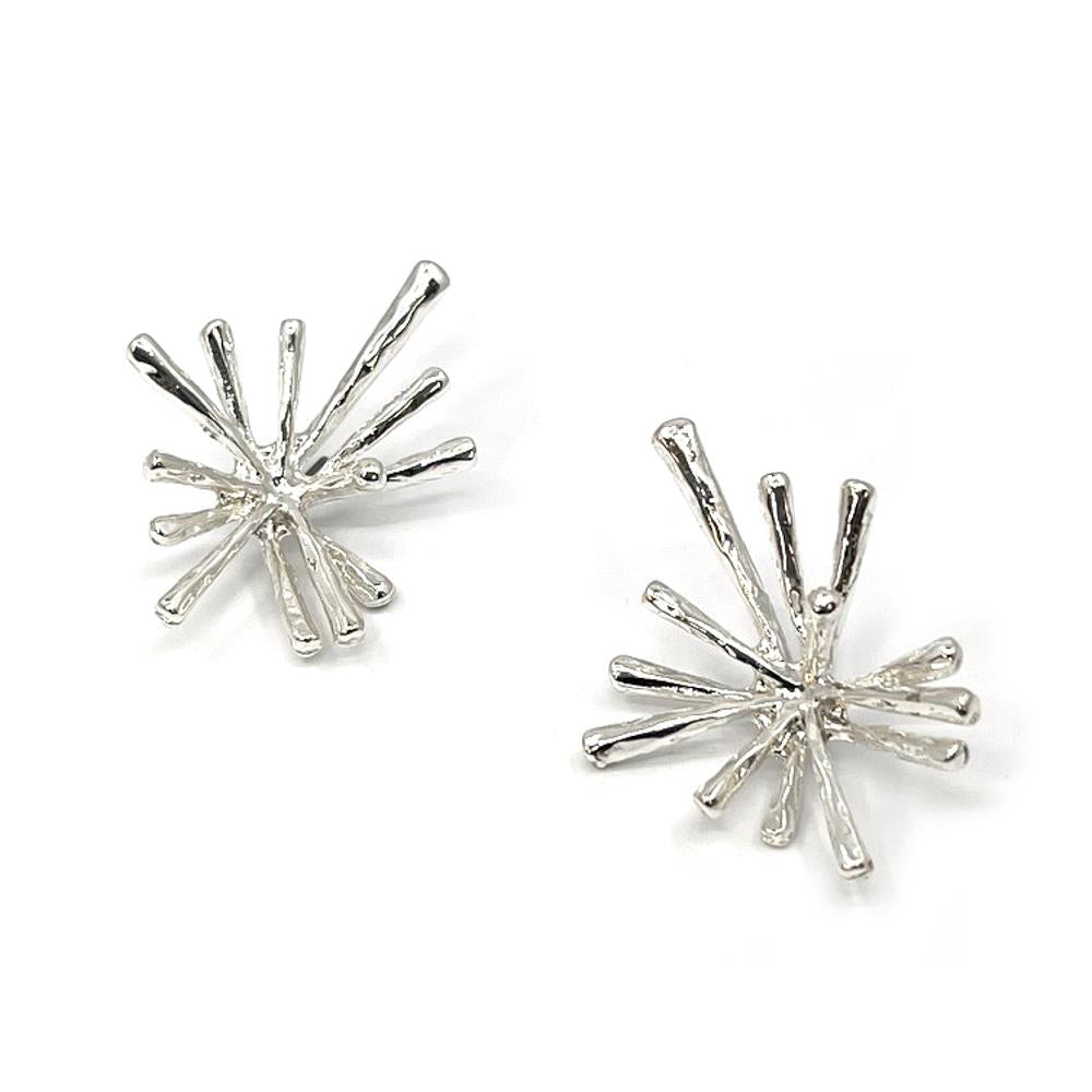 Photo of silver stud earrings in a "starburst" shape 