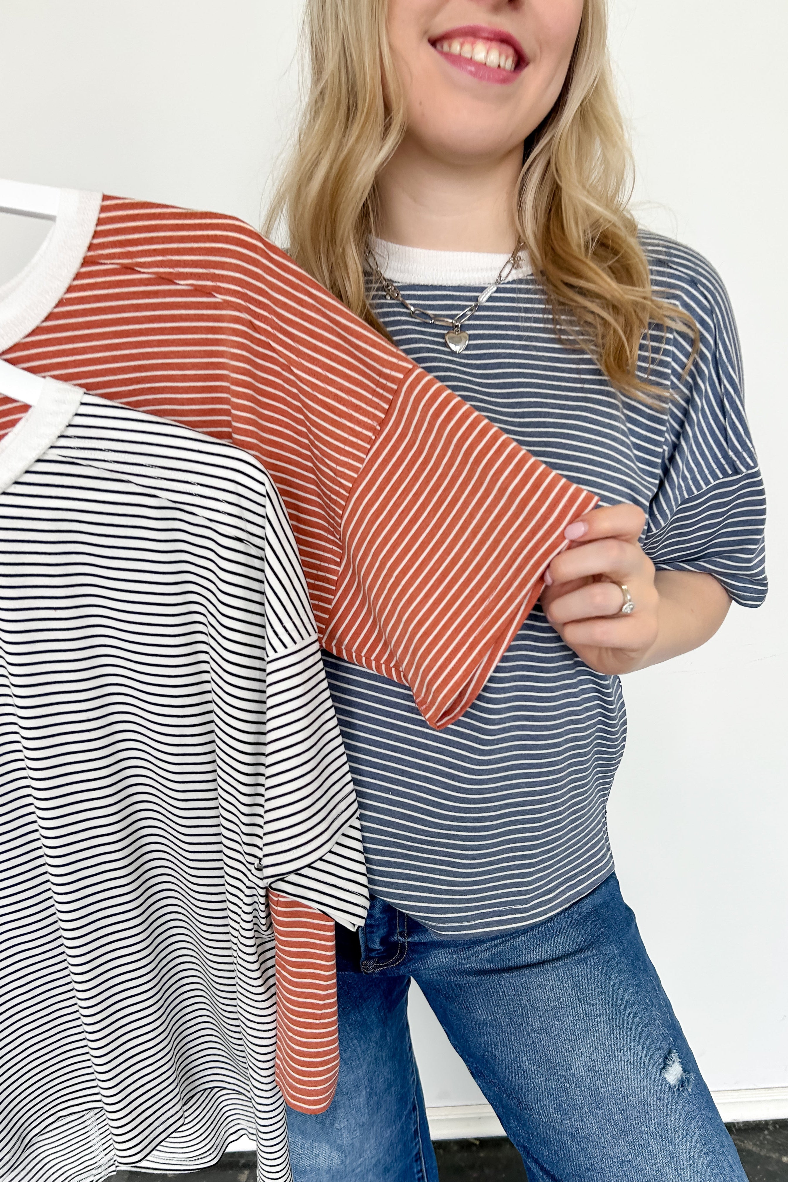 White and black striped tee with ringer neckline. Short sleeve. Oversized fit.