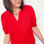 Collared red v neck short sleeve sweater. Knitted look. Regular fit.