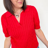 Collared red v neck short sleeve sweater. Knitted look. Regular fit.