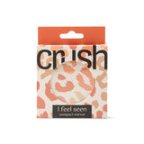 Packaged compact mirror with 'crush' branding on a white background