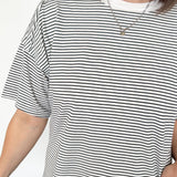 White and black striped tee with ringer neckline. Short sleeve. Oversized fit.