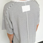 White and black striped tee with ringer neckline. Short sleeve. Oversized fit.