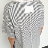 White and black striped tee with ringer neckline. Short sleeve. Oversized fit.