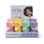 Set of makeup sponges with colorful packaging on a white background