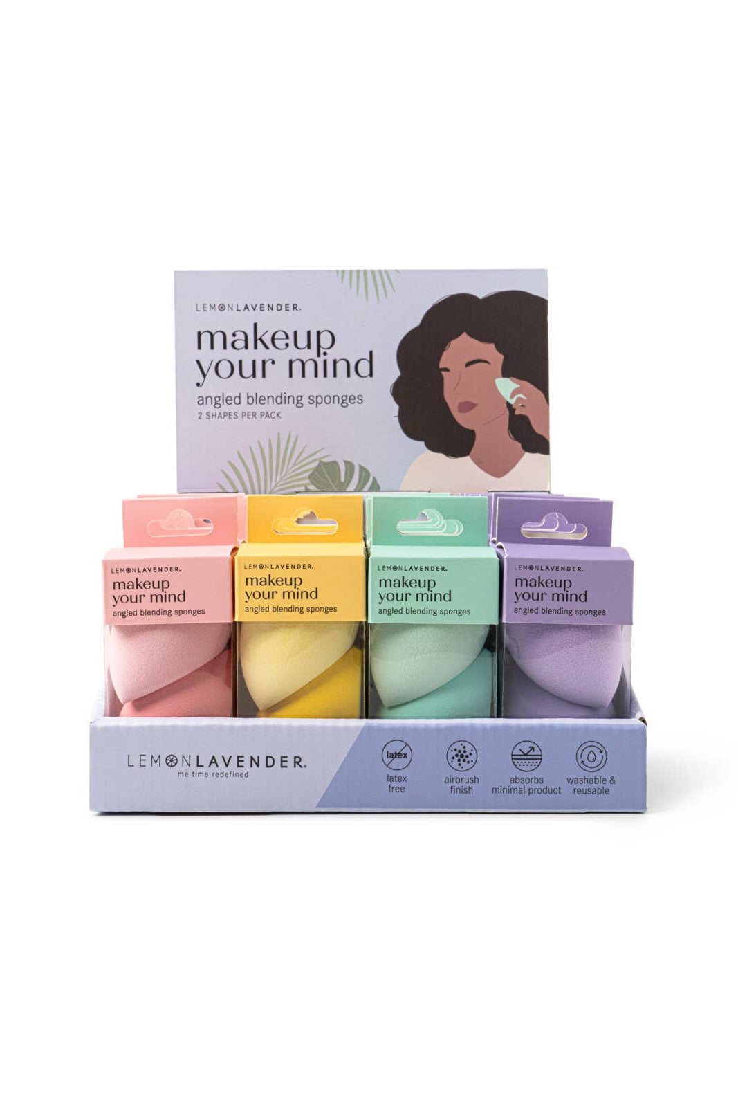 Set of makeup sponges with colorful packaging on a white background