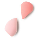 Two pink makeup sponges on a white background