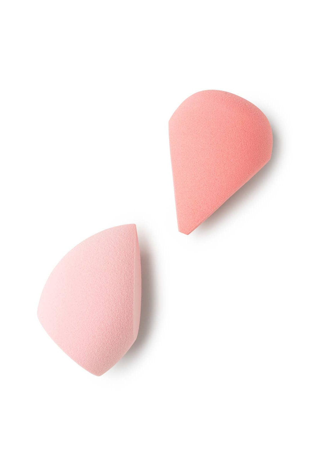 Two pink makeup sponges on a white background