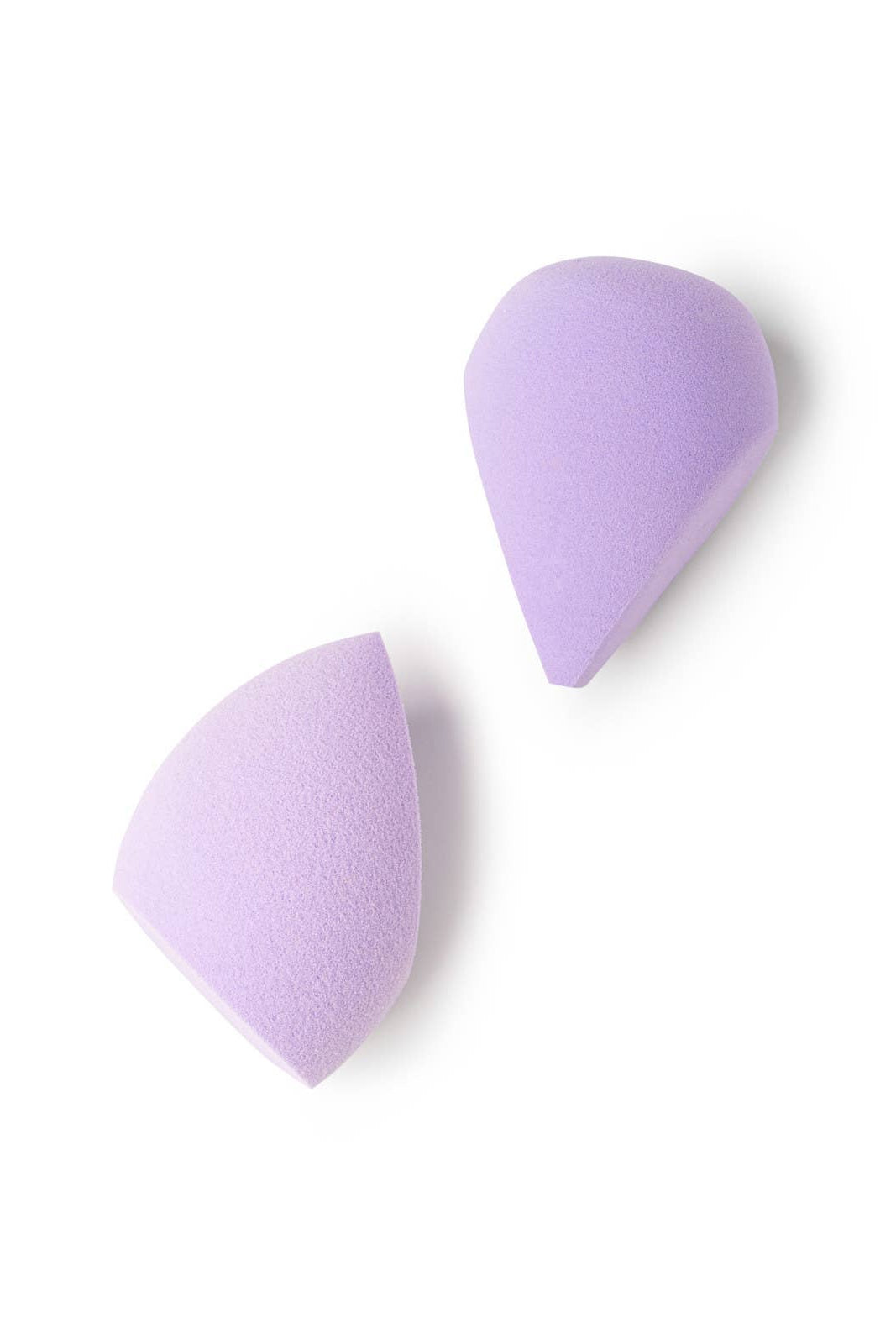 Two purple makeup sponges on a white background