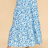 Blue and white floral skirt. Maxi length. Stretchy waistband. Tiered style.