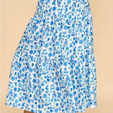 Blue and white floral skirt. Maxi length. Stretchy waistband. Tiered style.