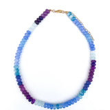 Multicolored beaded necklace on a white background