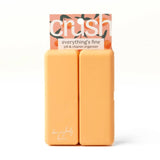 Two orange bars of soap with a 'crush' packaging on a white background