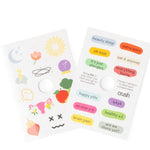 Two packages of stickers with colorful designs and text on a white background