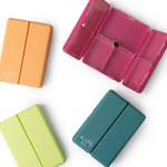 Four colorful rectangular containers on a white background