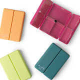 Four colorful rectangular containers on a white background