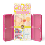 Pink makeup case with a colorful 'Grush' packaging on a white background