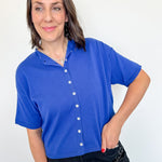 Woman wearing a blue shirt with a white background