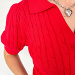 Collared red v neck short sleeve sweater. Knitted look. Regular fit.