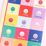 Notebook with colorful smiley face design on a light green background