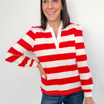Woman wearing a red and white striped shirt against a white background