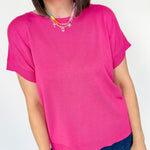 Basic short sleeve top. Slightly oversized fit. High round neckline. Pink in color.