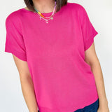 Basic short sleeve top. Slightly oversized fit. High round neckline. Pink in color.