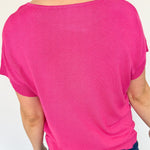 Basic short sleeve top. Slightly oversized fit. High round neckline. Pink in color.