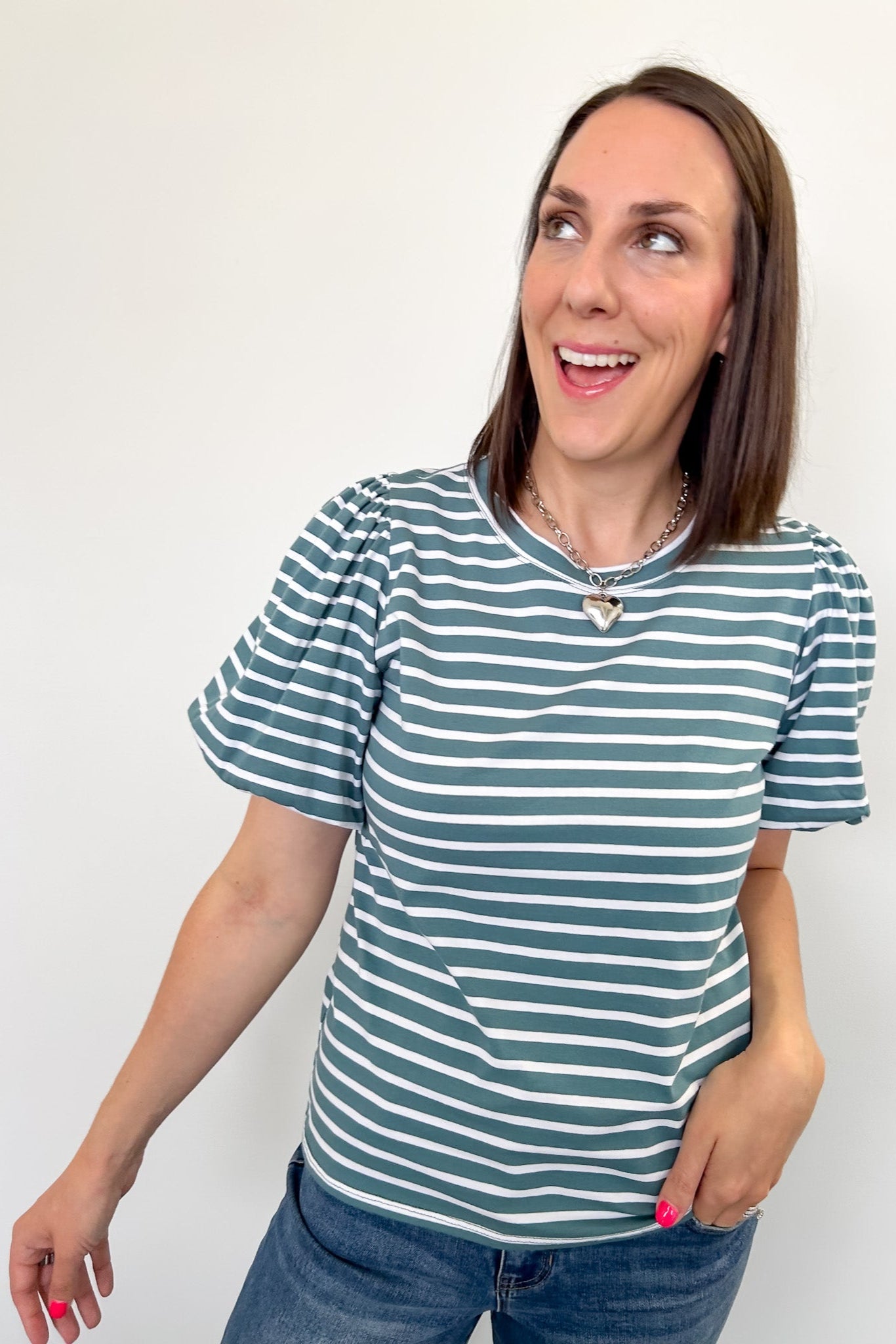 Crewneck tee with striped detailing. Slight puff sleeves. Regular fit. Seafoam and white in color.