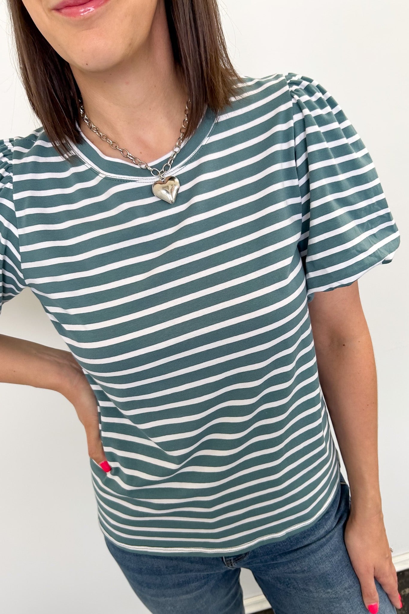 Crewneck tee with striped detailing. Slight puff sleeves. Regular fit. Seafoam and white in color.