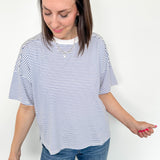Oversized tee with crew neckline. White and royal blue in color. Striped pattern. 