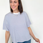 Oversized tee with crew neckline. White and royal blue in color. Striped pattern. 