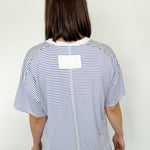 Oversized tee with crew neckline. White and royal blue in color. Striped pattern. 