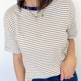 Photo of model wearing a pointelle striped tee with navy stripes 