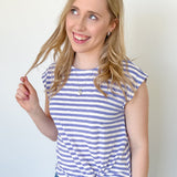 Photo of model wearing a striped top with twisted hem and cap sleeves