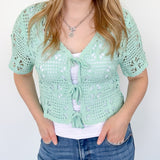 Mint crochet cropped sweater with three ties in the front. Perfect for layering over a tank or dress.