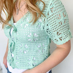 Mint crochet cropped sweater with three ties in the front. Perfect for layering over a tank or dress.